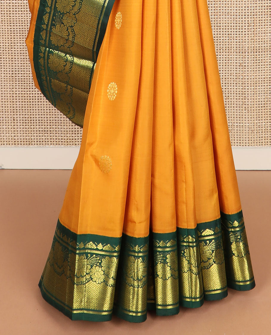 Yellow zari buttas Kanchipuram silk saree, contrast one-sided korvai border of Banaras, floral design & mayil kann & intricate pallu