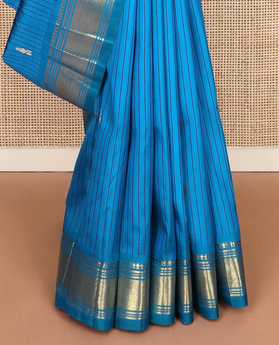 Blue striped & zari buttas Kanchipuram silksaree, one-sided border of panner sombu,banaras,muthu & jaal designs & zari design pallu