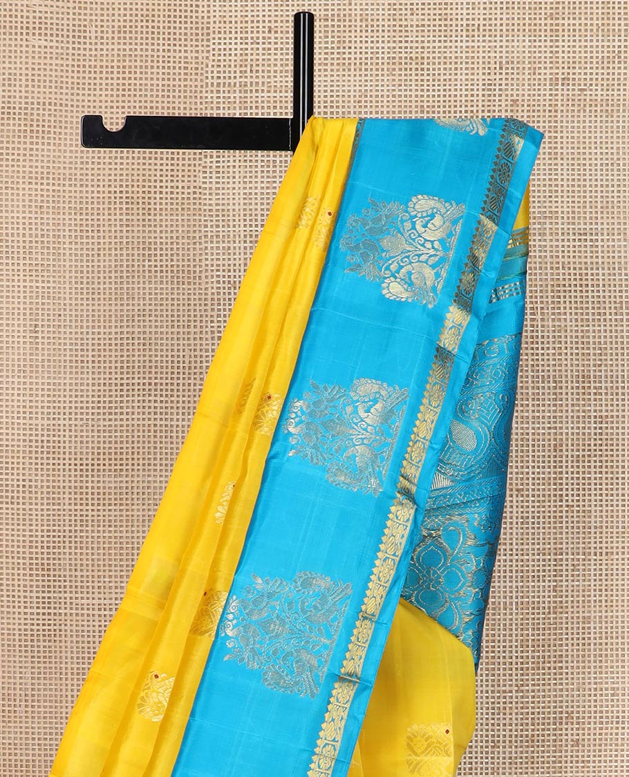 Yellow meena mayil buttas silk saree, contrast korvai one-sided border of thilakam,annam chakram & mayil designs & floral design pallu