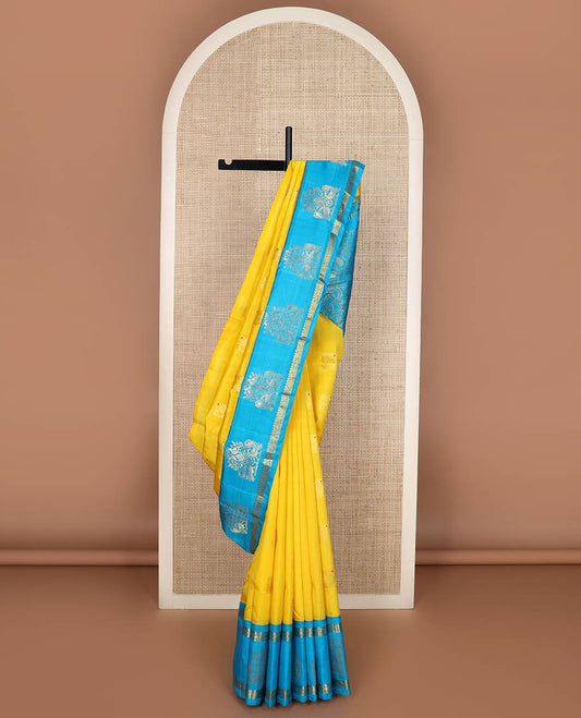 Yellow meena mayil buttas silk saree, contrast korvai one-sided border of thilakam,annam chakram & mayil designs & floral design pallu