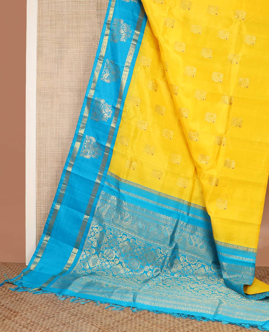 Yellow meena mayil buttas silk saree, contrast korvai one-sided border of thilakam,annam chakram & mayil designs & floral design pallu