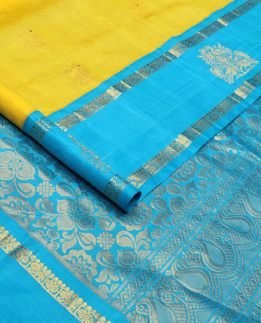 Yellow meena mayil buttas silk saree, contrast korvai one-sided border of thilakam,annam chakram & mayil designs & floral design pallu