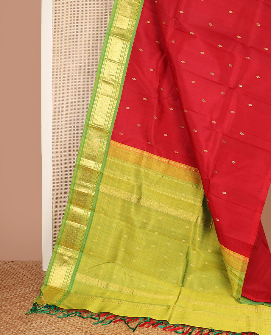 Red zari buttas Kanchipuram silk saree, contrast one-sided korvai border of paneer sombu, banaras, muthu, and mayil kann design, and zari design pallu