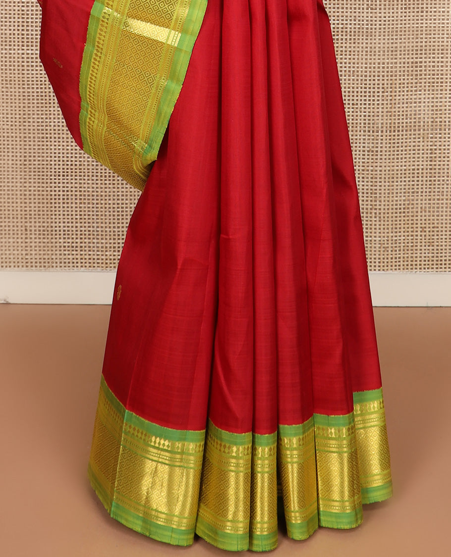 Red zari buttas Kanchipuram silk saree, contrast one-sided korvai border of paneer sombu, banaras, muthu, and mayil kann design, and zari design pallu