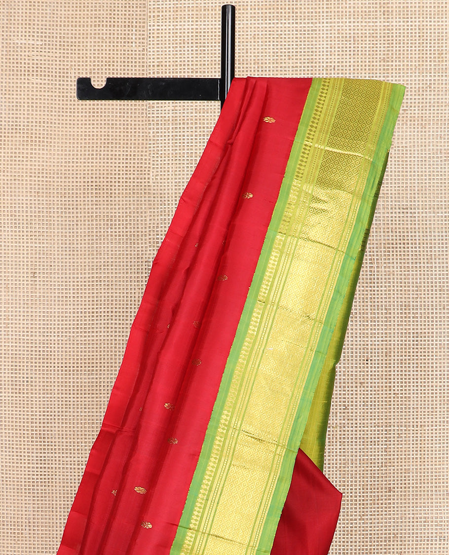 Red zari buttas Kanchipuram silk saree, contrast one-sided korvai border of paneer sombu, banaras, muthu, and mayil kann design, and zari design pallu