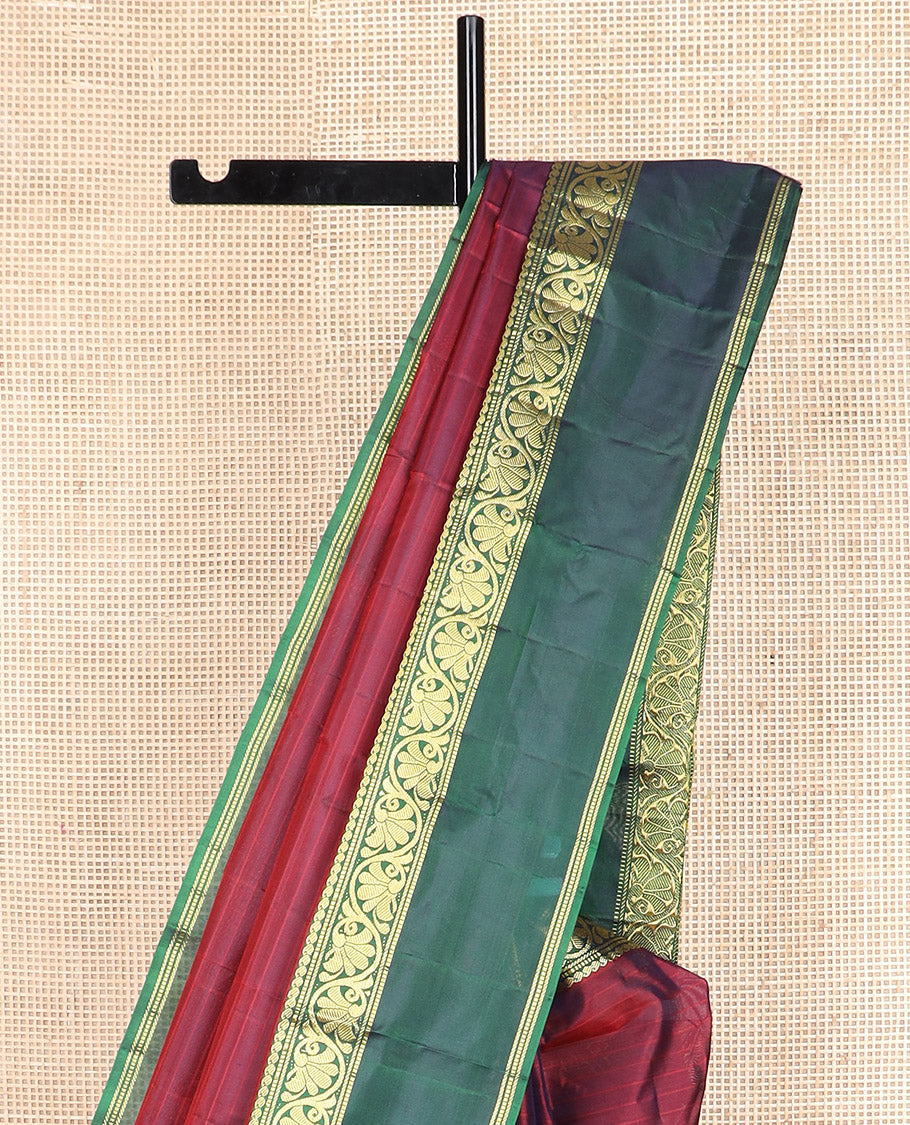 Maroon striped Kanchipuram silk saree, contrast rettai pettu border of manga, muthu, banaras, and kodi visiry designs, and zari striped pallu