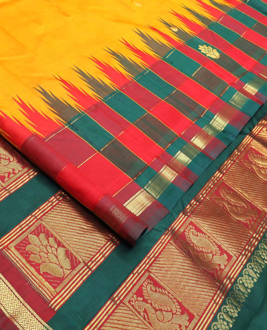 Yellow zari buttas Kanchipuram silk saree, contrast thazampoo rekku checked one-sided border of banaras, and vanki designs, and pallu of intricate designs