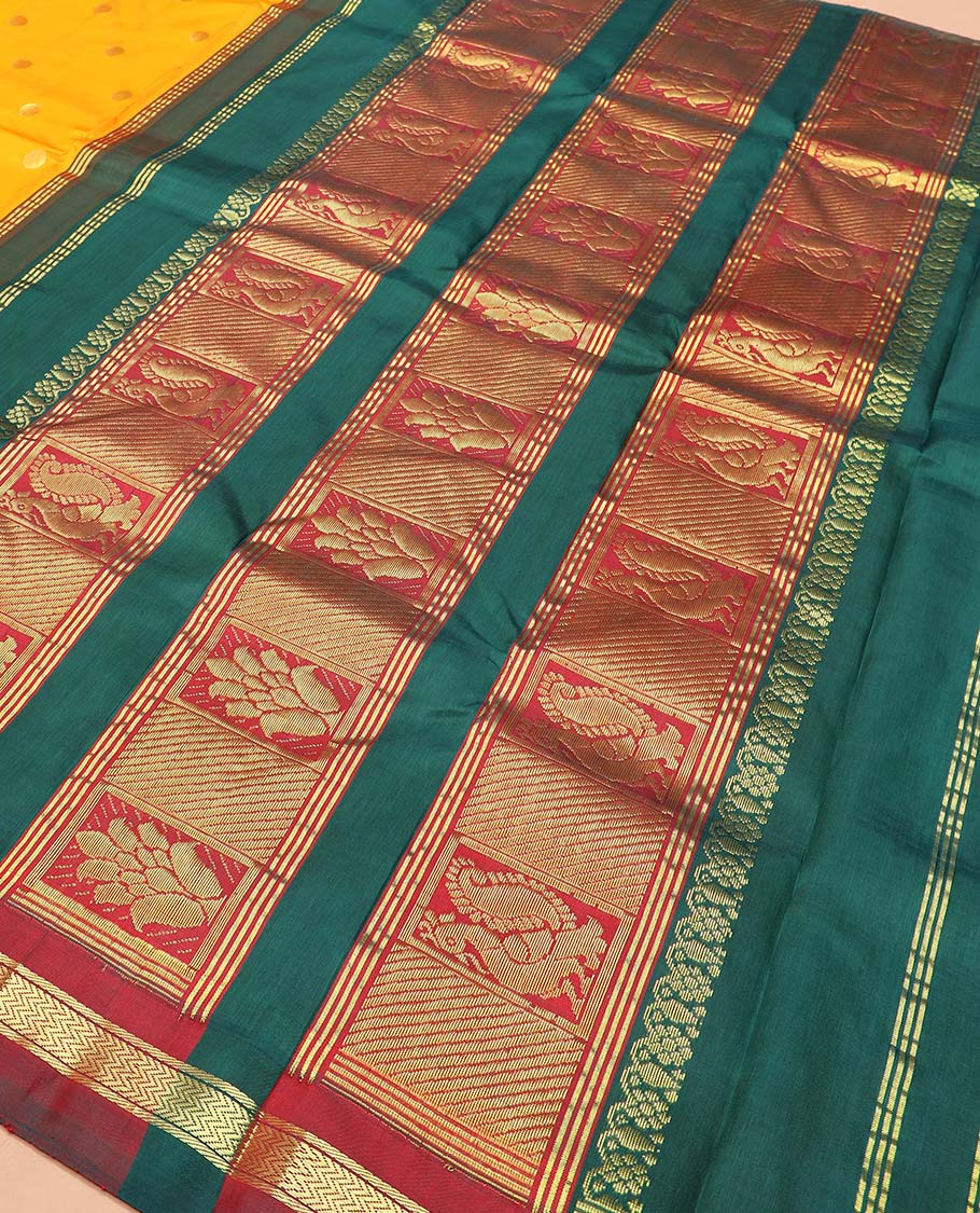 Yellow zari buttas Kanchipuram silk saree, contrast thazampoo rekku checked one-sided border of banaras, and vanki designs, and pallu of intricate designs