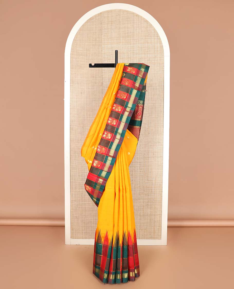 Yellow zari buttas Kanchipuram silk saree, contrast thazampoo rekku checked one-sided border of banaras, and vanki designs, and pallu of intricate designs