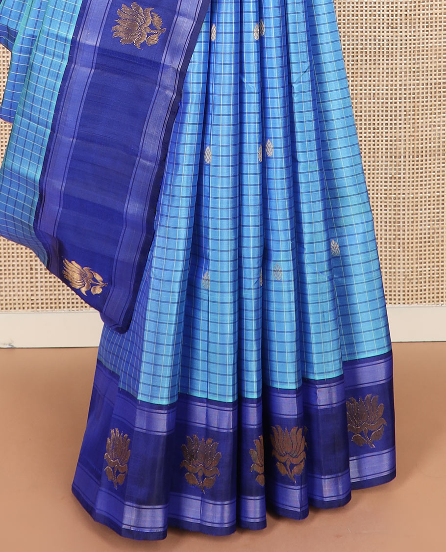 Blue checked and buttas Kanchipuram silk saree, contrast border of lotus designs, and pallu of zari designs