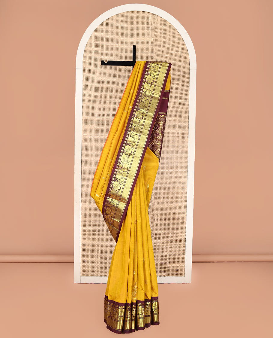 Mustard Kanchipuram Silk Saree, Decorated with Zari Buttas, Complemented by Contrast One-Sided Korvai Border of Rekku, Banaras, Floral and Mayil Kann Designs, Pallu of Floral-Paisley Designs, and Comes Without a Blouse