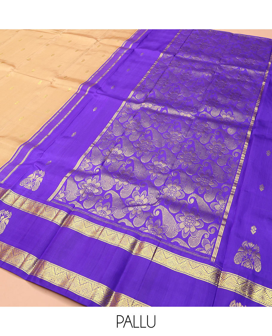 Sandal Kanchipuram Silk Saree, Highlighted with Zari Buttas on Its Body, Complemented by a Contrast One-Sided Korvai Border of Diamond and Mayil Designs, Pallu Features Floral and Paisley Designs, and Comes Without a Blouse