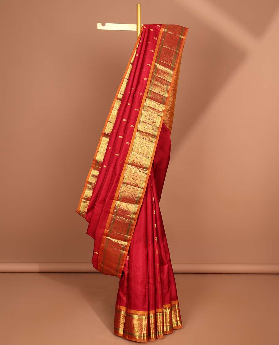 Red paisley buttas kanchipuram silk saree with contrast border of intricate zari design border & zari design pallu