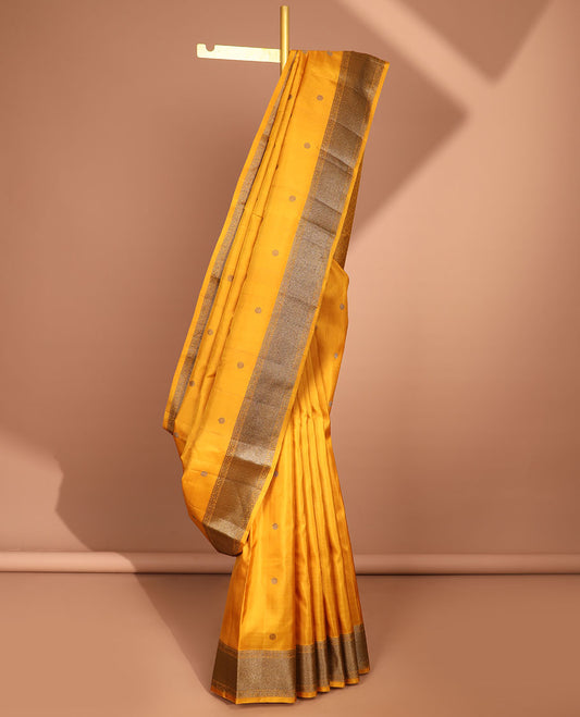 Yellow round buttas kancheepuram silk saree with self zari design border & in tricate zari design border