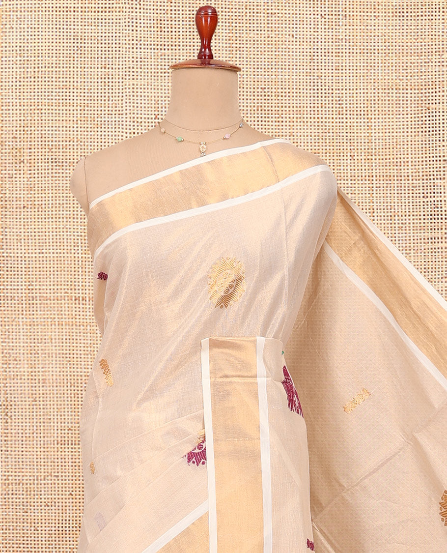 Cream Kerala Cotton Saree, Accentuated with Thread and Zari Buttas All Over Its Body, a Zari Bavanji Border, Pallu of Elephant Designs, and Paired with a Matching Blouse