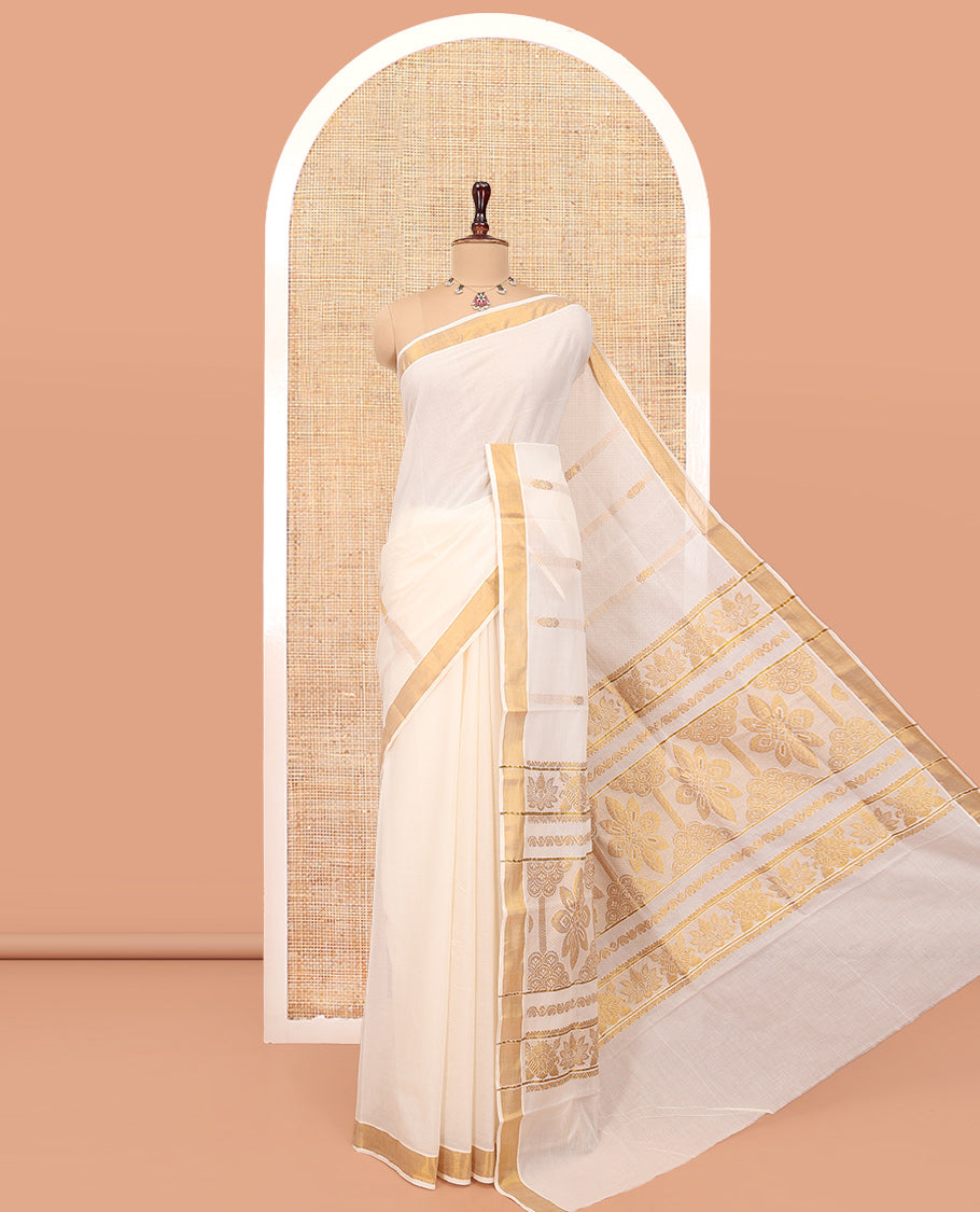 Cream Kerala Cotton Saree, Adorned with Zari Stripes All Over Its Body, a Subtle Bavanji Border, Pallu Features Intricate Designs, and Is Paired with a Matching Blouse