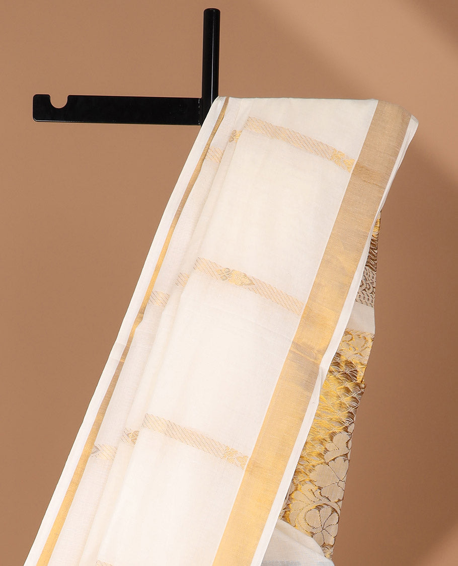 Cream kerala saree with zari stripes, zari border & pallu of floral designs