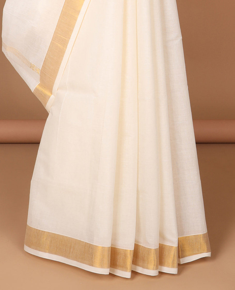 Cream kerala saree with zari stripes, zari border & pallu of floral designs