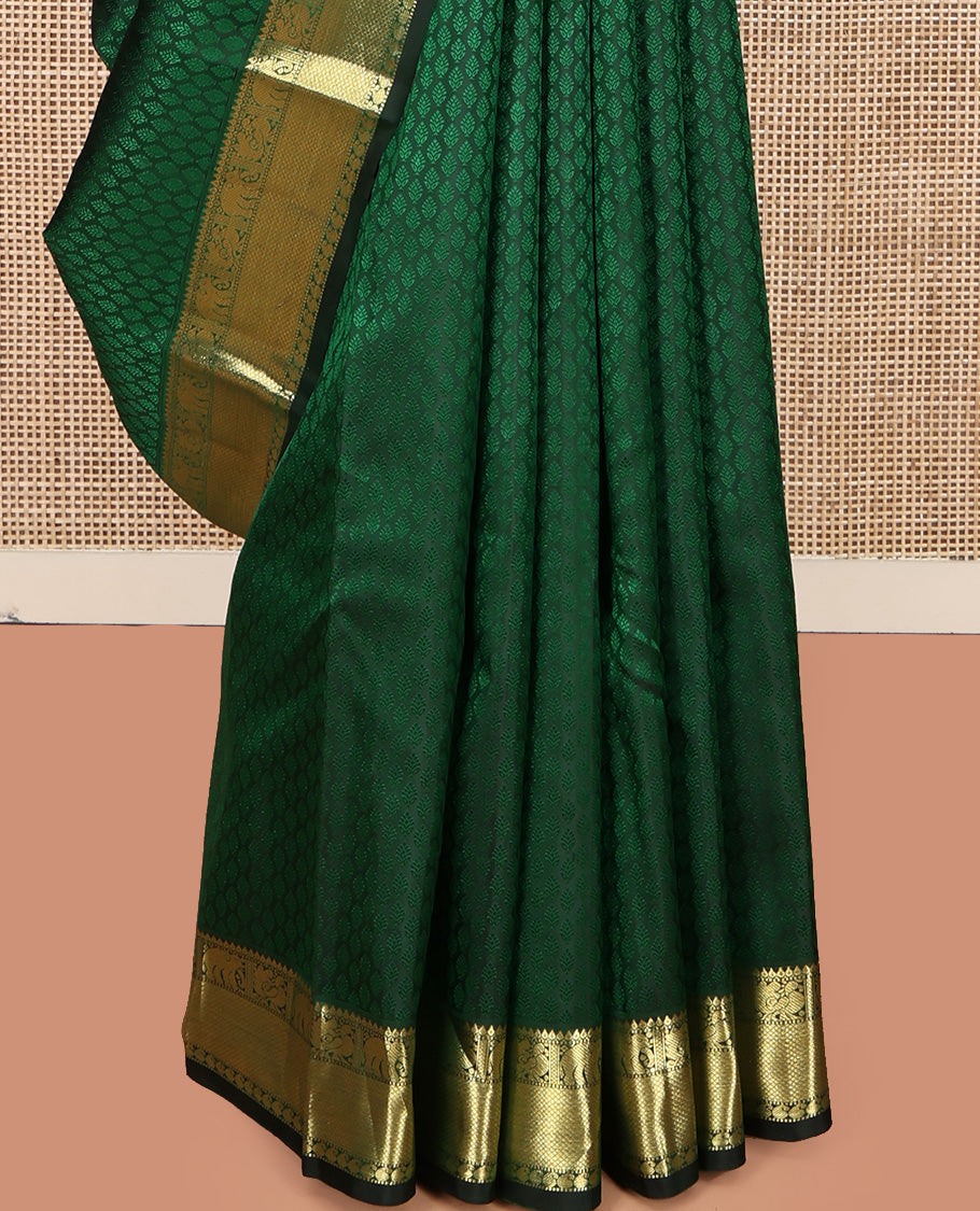 Green Embossed Parampara Silk Saree, Elevated with Zari Border of Thilakam, Mayil, Yaanai, Mayil Kann, and Manga Designs, Grand Jaal Pallu and Paired with a Matching Blouse