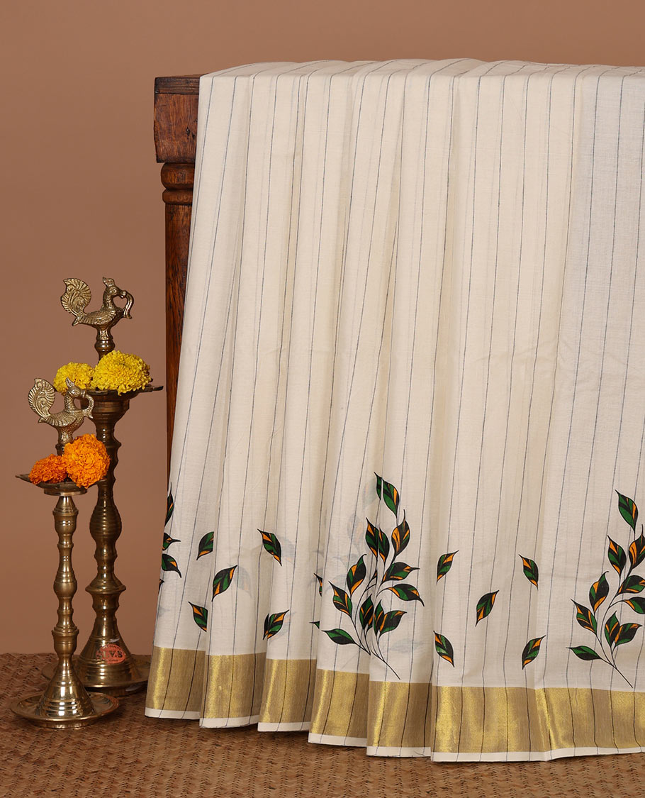 Cream & black Kerala cotton saree with stripes & leaf motifs screen print, golden zari border & screen printed pallu
