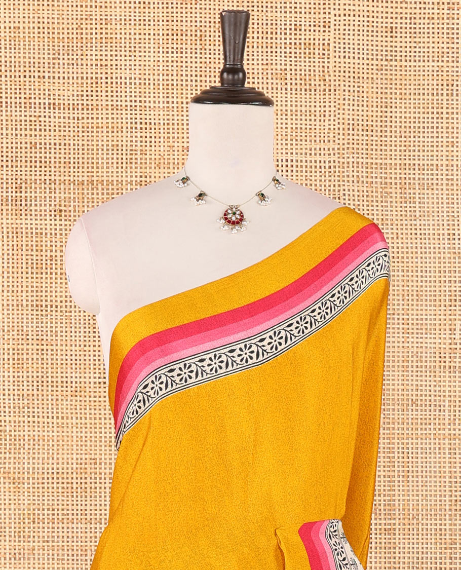 Gold plain crepe silk saree, contrast floral & geometric block printed-style border, printed pallu & contrast plain blouse