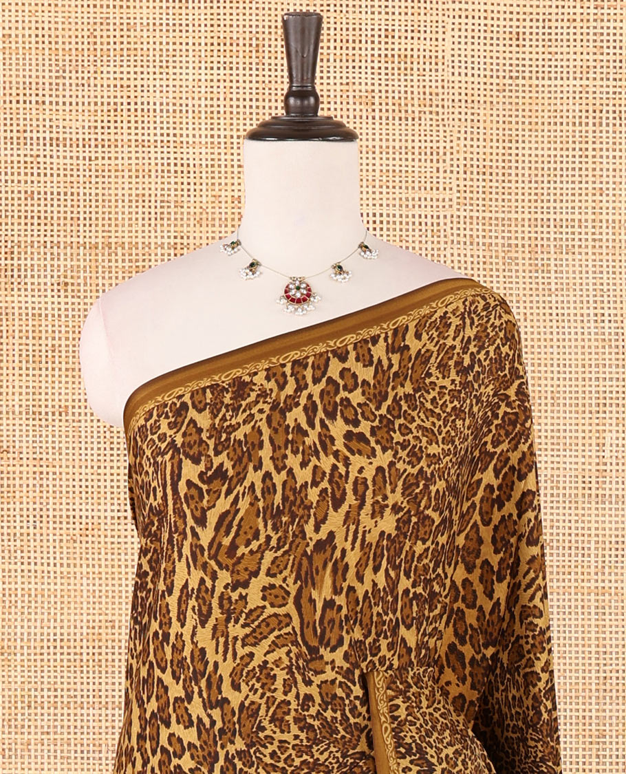 Khaki brown leopard-skin-like printed crepe silk saree, plain piping border, geometric motif printed pallu & animal-skin print blouse