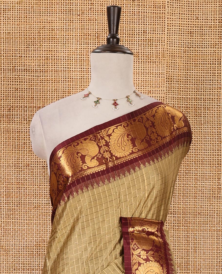 Green zari checked semi-taffeta silk saree, contrast annam motifs zari woven temple border, striped pallu & contrast striped zari border blouse