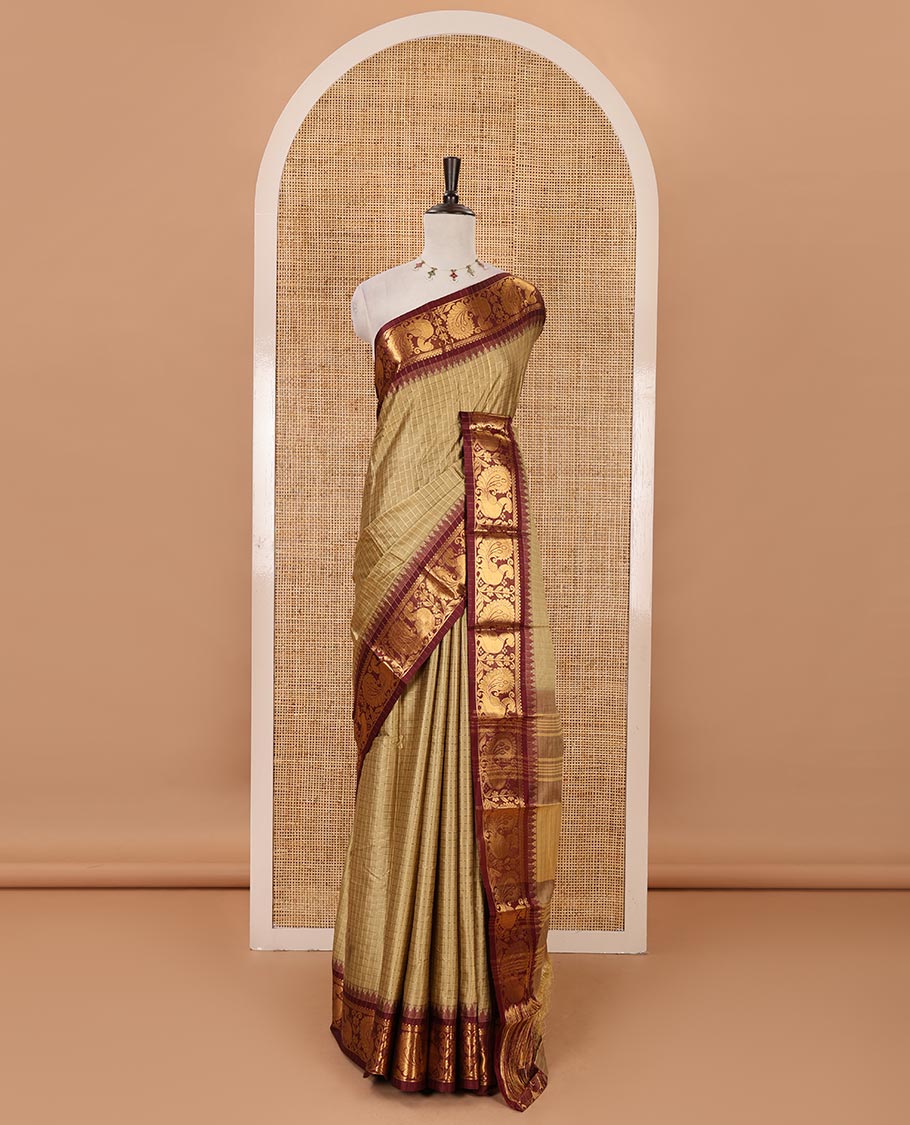 Green zari checked semi-taffeta silk saree, contrast annam motifs zari woven temple border, striped pallu & contrast striped zari border blouse