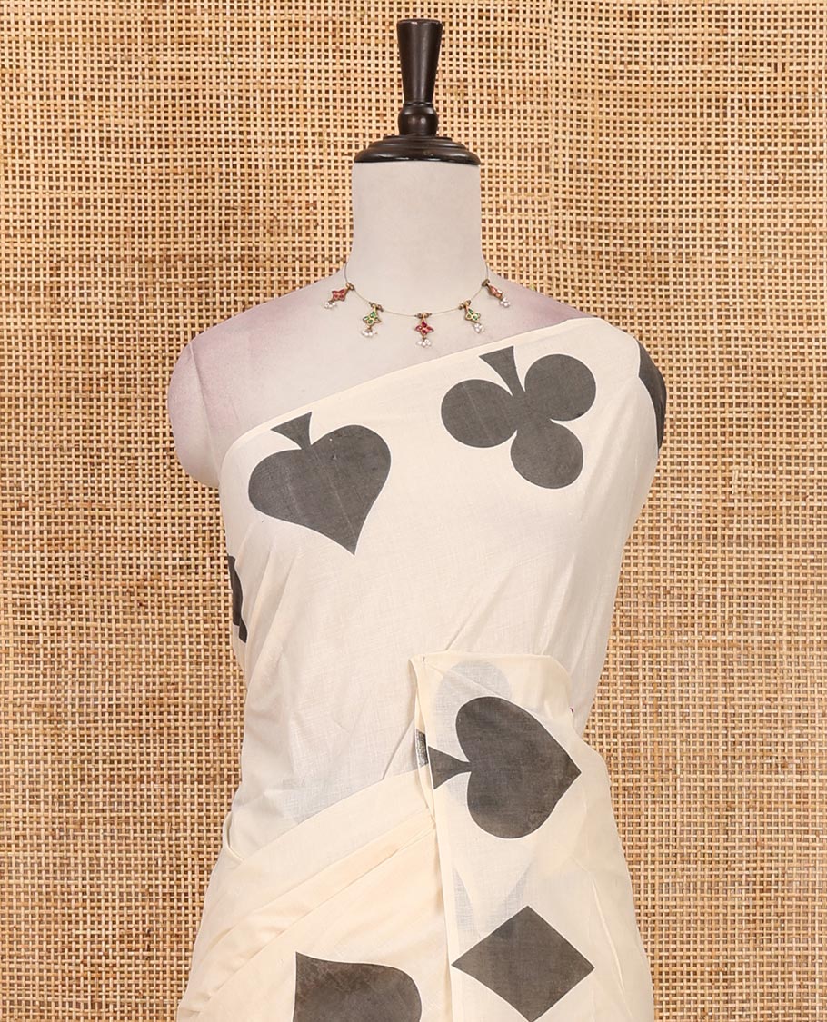 Cream-black plain Kerala cotton saree, contrast color cards-theme printed border of Diamonds, Clubs, and Spades, leheriya-striped pallu, and plain blouse