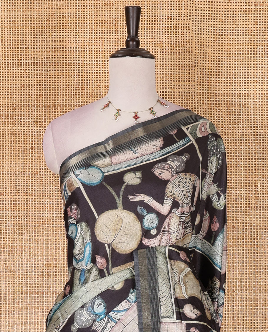 Black kalamkari ancient human figurines and animal motifs printed semi-tussar saree, gold zari piping border, printed pallu, and contrast printed blouse