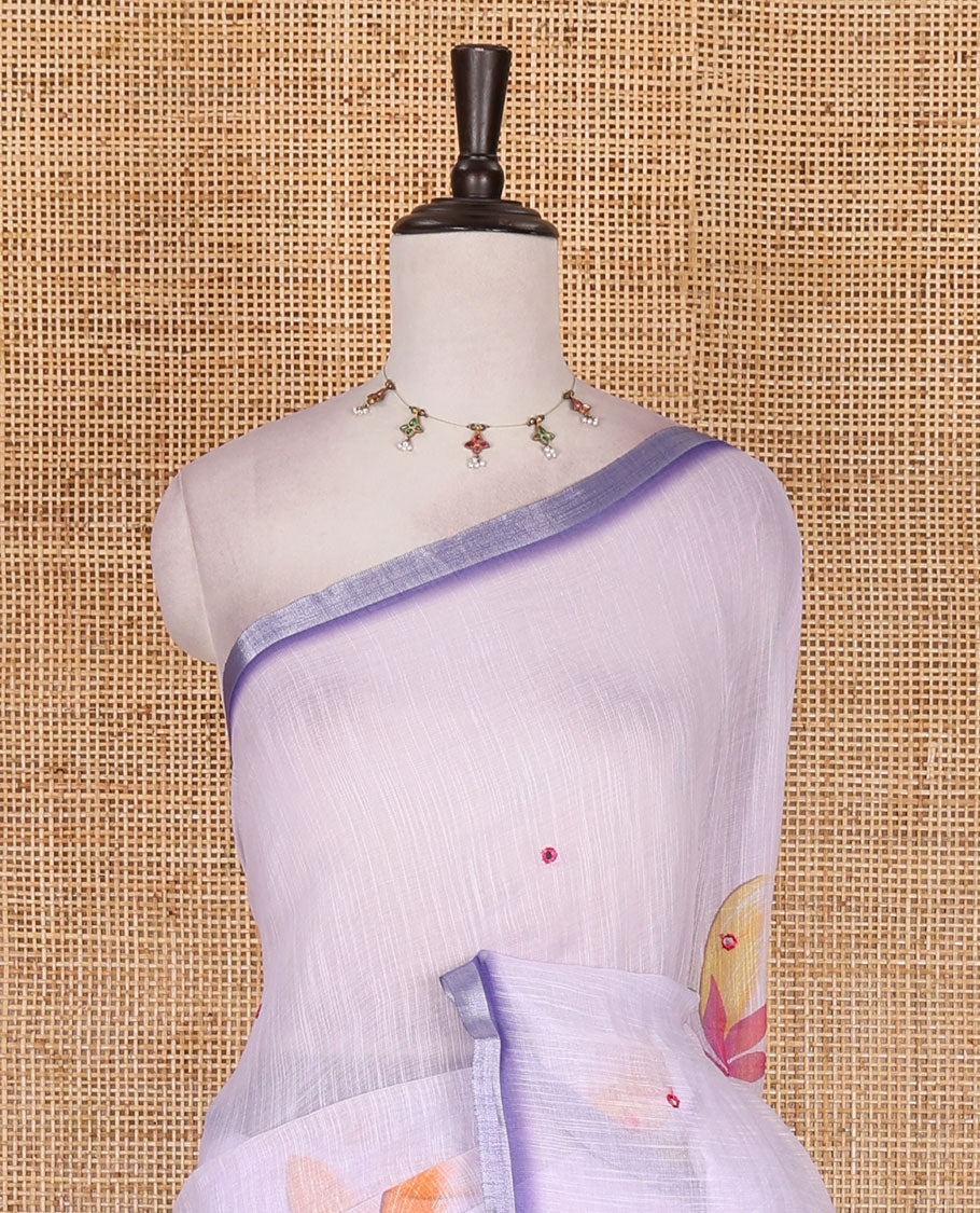 Lavender colorful floral vine printed with mirror embroidered linen saree, contrast zari piping border, and contrast printed blouse