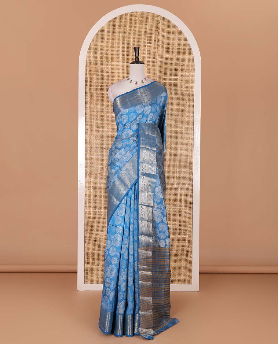 Blue uniquely printed semi-tussar saree, traditional zari border, zari striped pallu, and a matching blouse