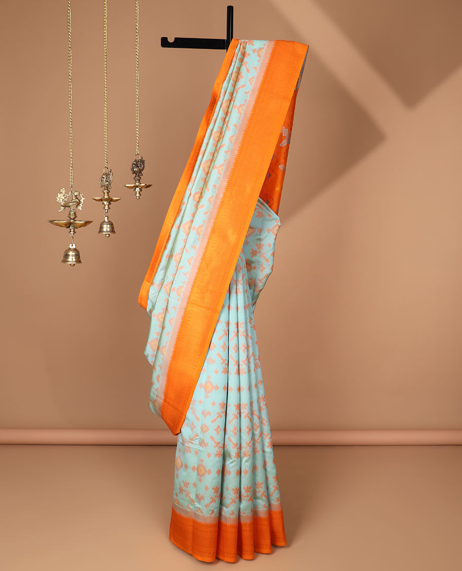 Sea green ikkat design mulberry silk saree with contrast border & ikkat pallu along with self embosed butta blouse