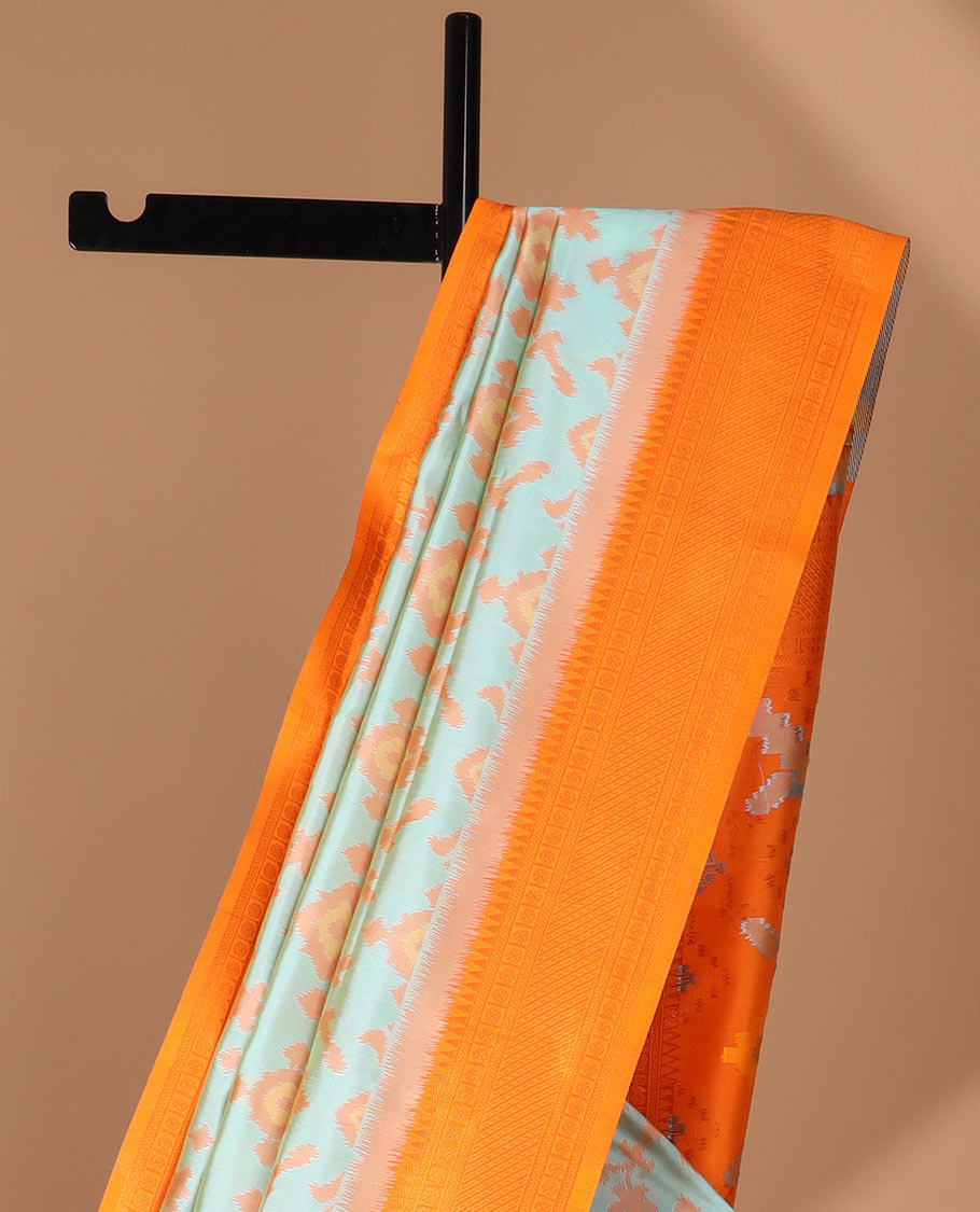 Sea green ikkat design mulberry silk saree with contrast border & ikkat pallu along with self embosed butta blouse