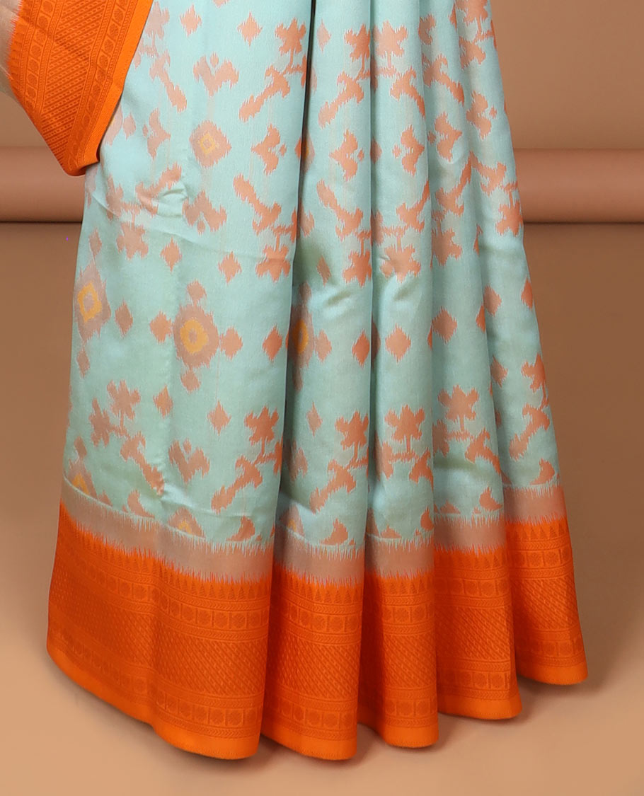 Sea green ikkat design mulberry silk saree with contrast border & ikkat pallu along with self embosed butta blouse