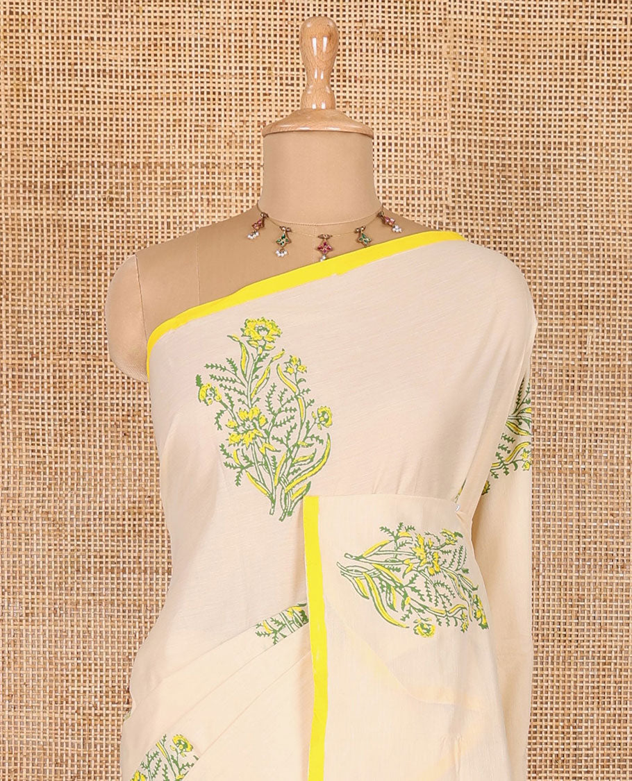 Borderless cream floral motifs printed South cotton saree with a matching blouse, and a contrast floral-paisley printed blouse