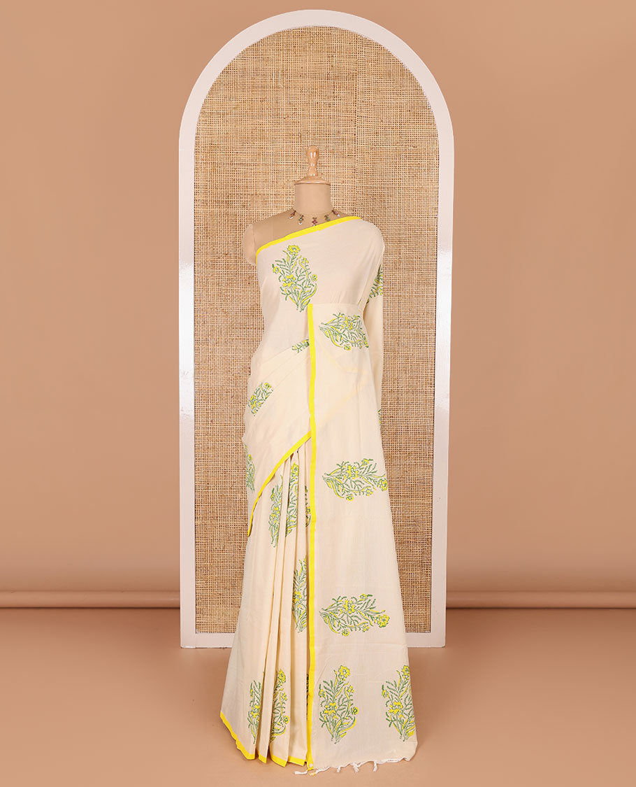 Borderless cream floral motifs printed South cotton saree with a matching blouse, and a contrast floral-paisley printed blouse