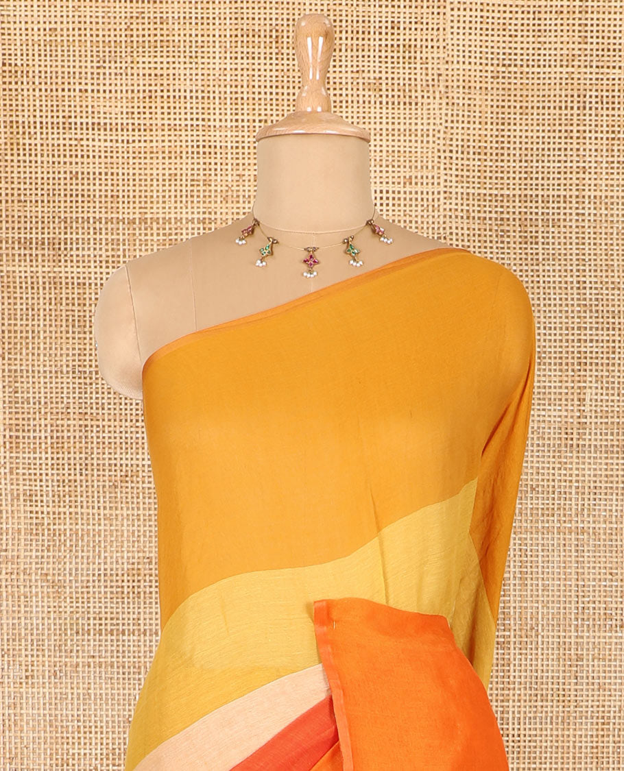 Borderless orange ombre-colored striped Khadi mul cotton saree, multi-colored tasseled pallu, and a matching blouse
