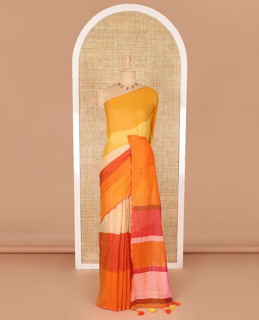 Borderless orange ombre-colored striped Khadi mul cotton saree, multi-colored tasseled pallu, and a matching blouse