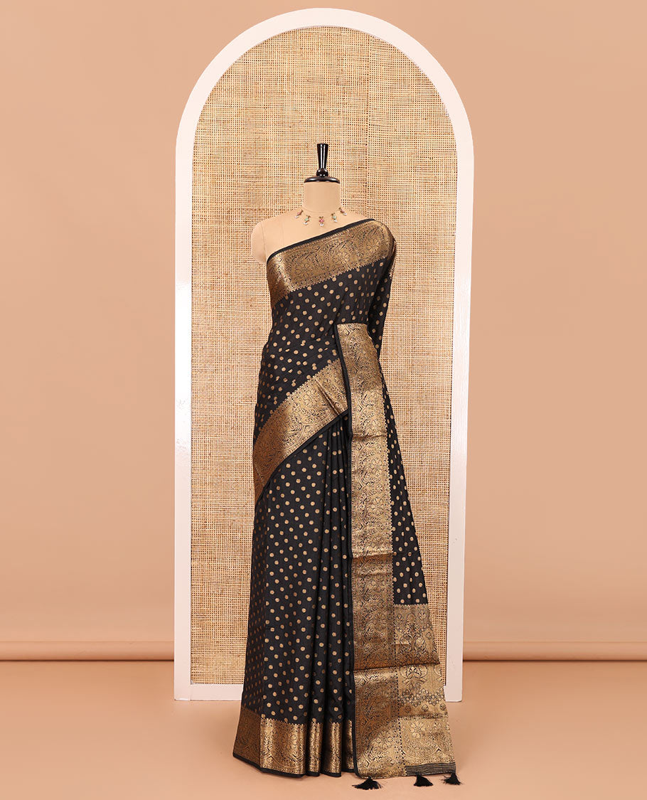 Black zari buttas woven semi tussar saree, zari intricate floral design border, zari-rich intricate pallu, and a plain blouse
