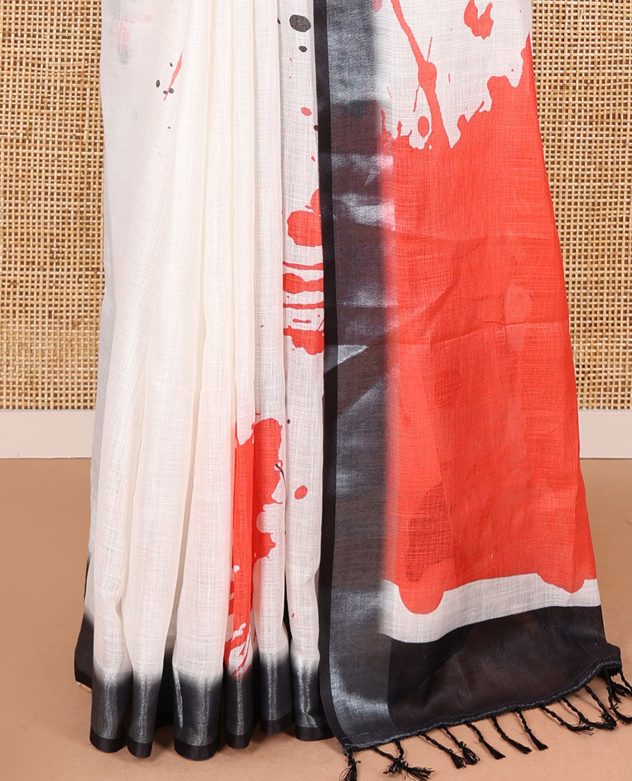 White colorful paint splashes printed linen cotton saree, contrast bavanji border, paint splashes printed pallu, and a contrast ajrakh printed blouse