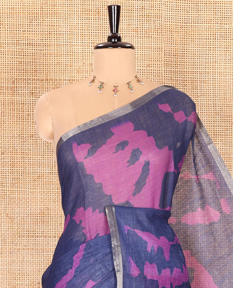 Navy blue shibori printed linen cotton saree, piping border, contrast floral printed pallu, and a contrast floral printed blouse