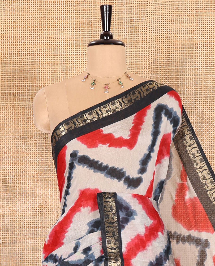 Red Muslin Cotton Saree Elevated with Zig-Zag Shibori Patterns Prints, Complemented by a Contrast Border of Deer Motifs in Zari, Pallu Decked Up with Scenery Print, and Paired with a Contrast Polka Dots Printed Blouse