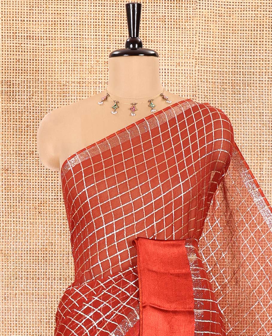 Maroon Viscose Georgette Saree Gleamed with Golden Zari Checks All Over Its Body, Adorned with a Satin Plain Border, a Self Pallu Featuring the Same Checks, and Paired with a Running Blouse