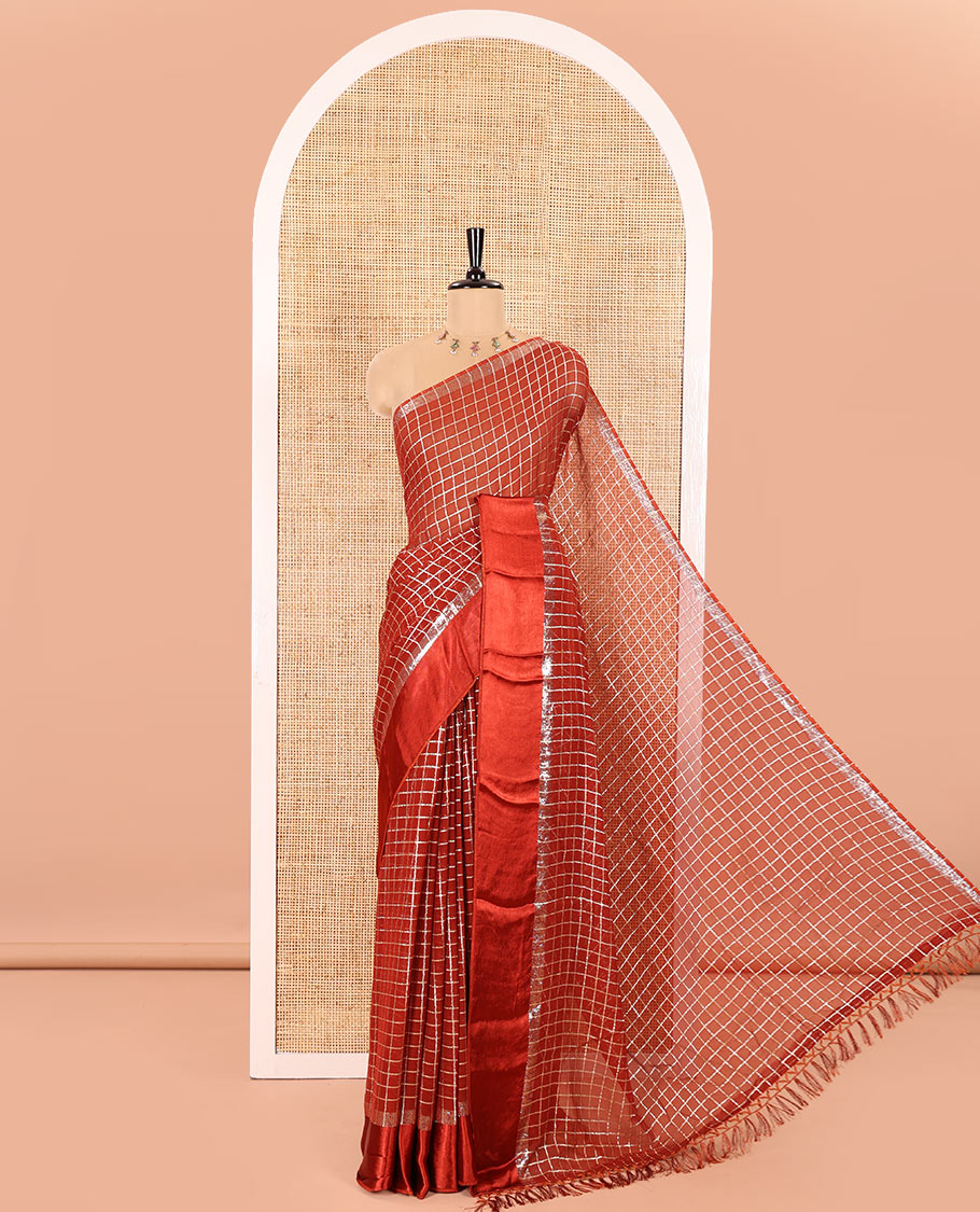 Maroon Viscose Georgette Saree Gleamed with Golden Zari Checks All Over Its Body, Adorned with a Satin Plain Border, a Self Pallu Featuring the Same Checks, and Paired with a Running Blouse