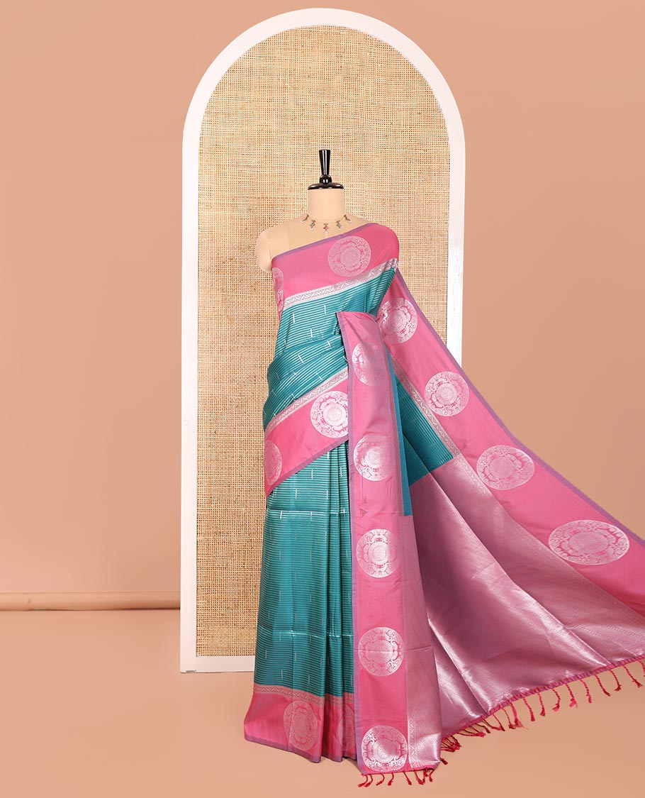 Green Elite Soft Silk Saree Ornamented with Vaira Oosi and Zari Buttas All Over Its Body, Complemented by a Contrast Border Featuring Chakram Motifs, Subtly Sparkled Pallu, and Paired with a Contrast Blouse