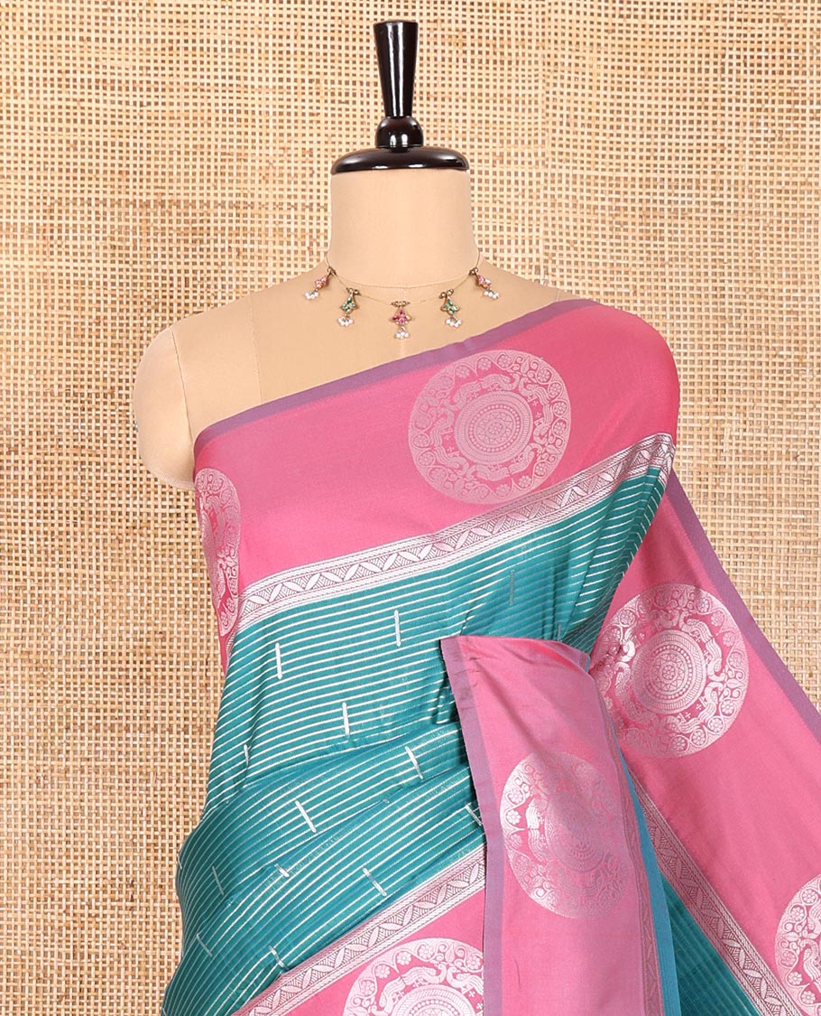 Green Elite Soft Silk Saree Ornamented with Vaira Oosi and Zari Buttas All Over Its Body, Complemented by a Contrast Border Featuring Chakram Motifs, Subtly Sparkled Pallu, and Paired with a Contrast Blouse