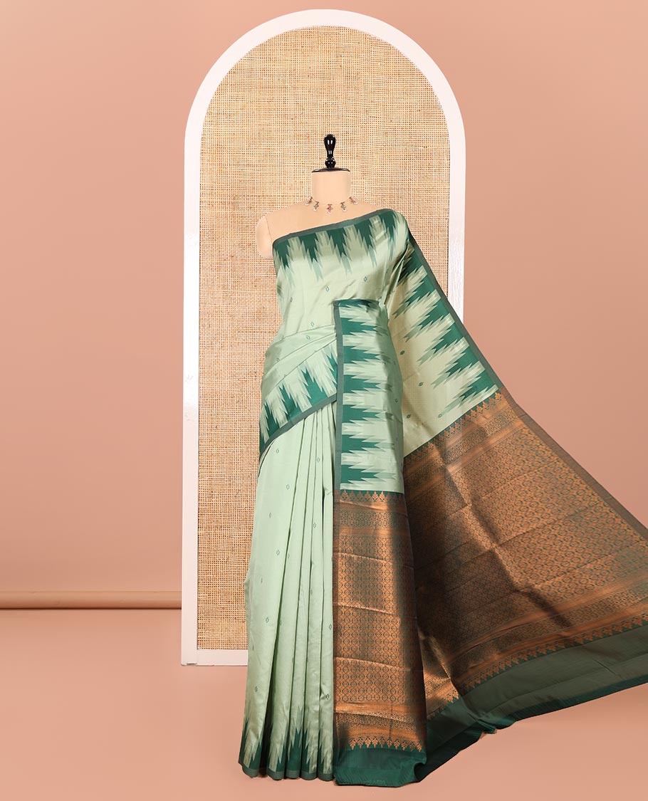 Pista Green Kanchi Silk Saree Highlighted by Thread Buttas All Over Its Body, Complemented by a Contrast Temple Border, Grandly Woven Pallu of Intricate Design Weave, and Paired with a Contrast Blouse