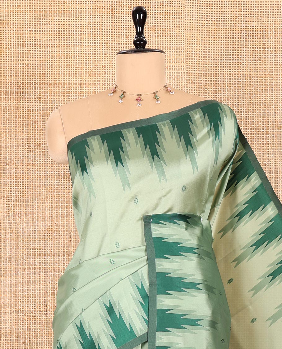 Pista Green Kanchi Silk Saree Highlighted by Thread Buttas All Over Its Body, Complemented by a Contrast Temple Border, Grandly Woven Pallu of Intricate Design Weave, and Paired with a Contrast Blouse