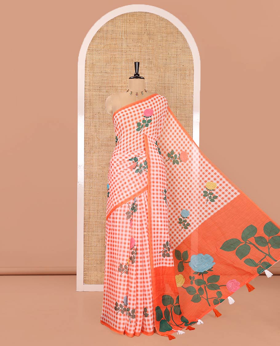 Borderless Orange Linen Cotton Saree, Elevated with Rose Floral Buttas and Checked Design on Its Body, Pallu Pictures a Beautiful Rose Floral Motifs, and Paired with a Matching Blouse